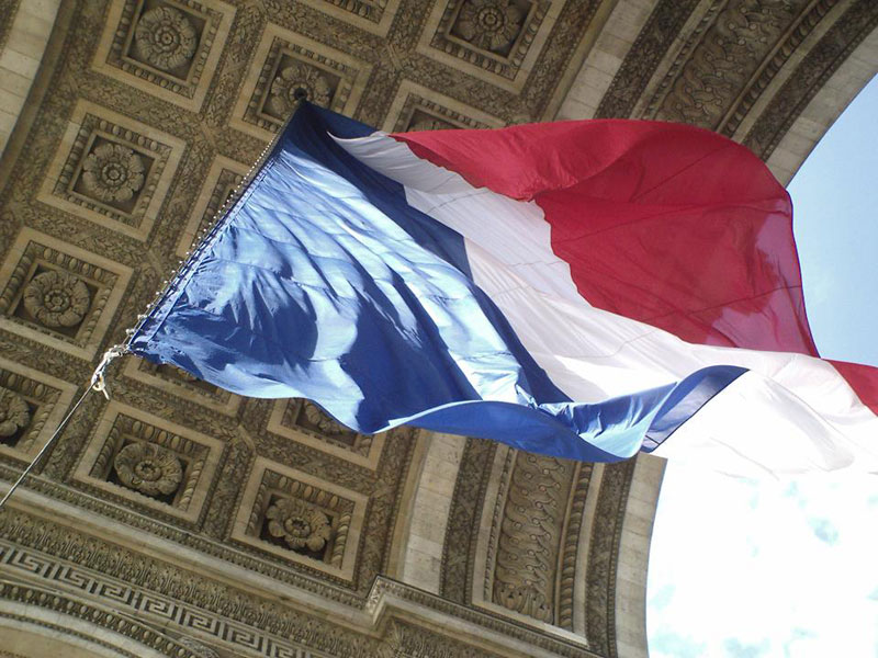 French flag flowing at the Arc du Triomphe Paris